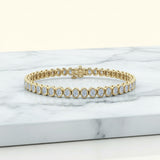14.00 ctw Bezel-Set Lab Created Oval Sapphire Tennis Bracelet in 14K Yellow Gold Overlay