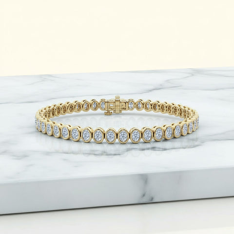 14.00 CTW Bezel-Set Lab Created Oval Sapphire Tennis Bracelet in 14K Yellow Gold Overlay
