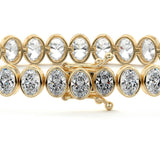 14.00 ctw Bezel-Set Lab Created Oval Sapphire Tennis Bracelet in 14K Yellow Gold Overlay