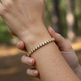 14.00 ctw Bezel-Set Lab Created Oval Sapphire Tennis Bracelet in 14K Yellow Gold Overlay