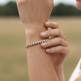 14.00 ctw Bezel-Set Lab Created Oval Sapphire Tennis Bracelet in 14K Yellow Gold Overlay